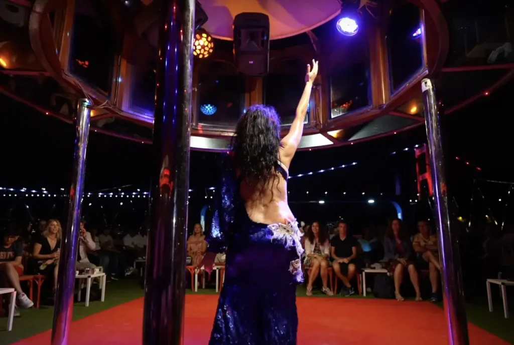 A dinner cruise on the Bosphorus with a live show, featuring traditional dance and bright lights.