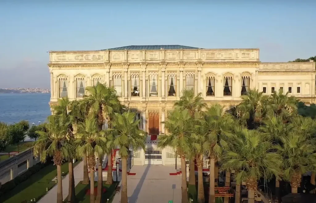 A drone view of Çırağan Palace, with its grand architecture and location by the Bosphorus.