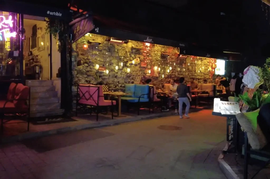 A cozy bar in Karaköy, Istanbul, with warm lighting and a welcoming atmosphere.