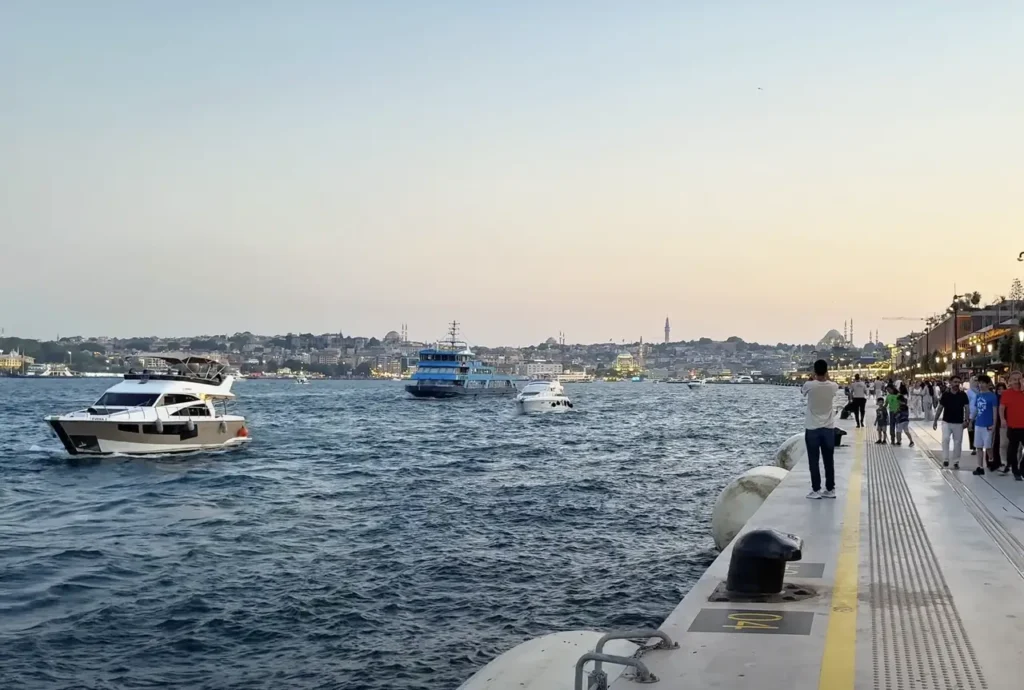 A view of Galataport along the Bosphorus, with modern architecture and the waterfront in the foreground.