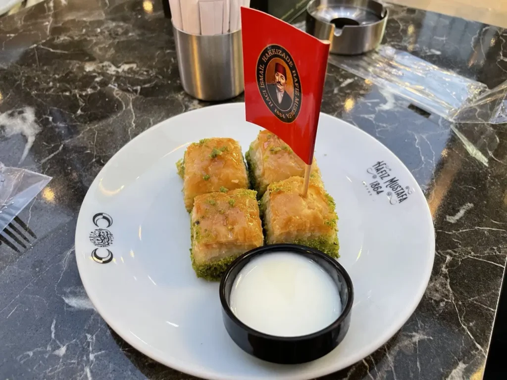 A plate of baklava at Hafız Mustafa, featuring pistachio and walnut varieties.