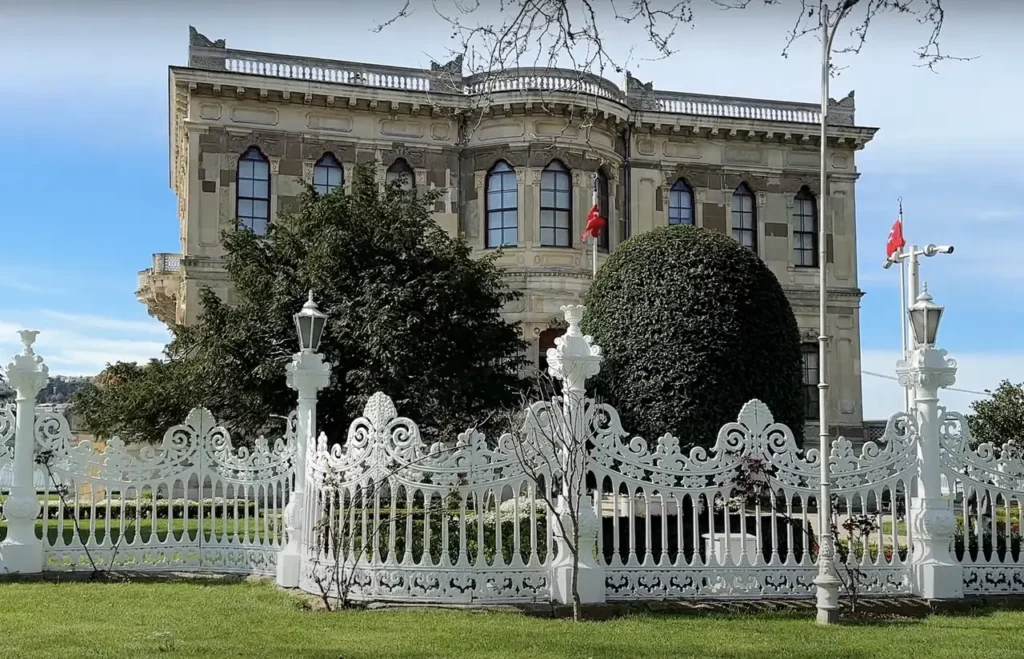 A view of Kucuksu Pavilion from its garden, showcasing the Ottoman architecture and lush greenery.