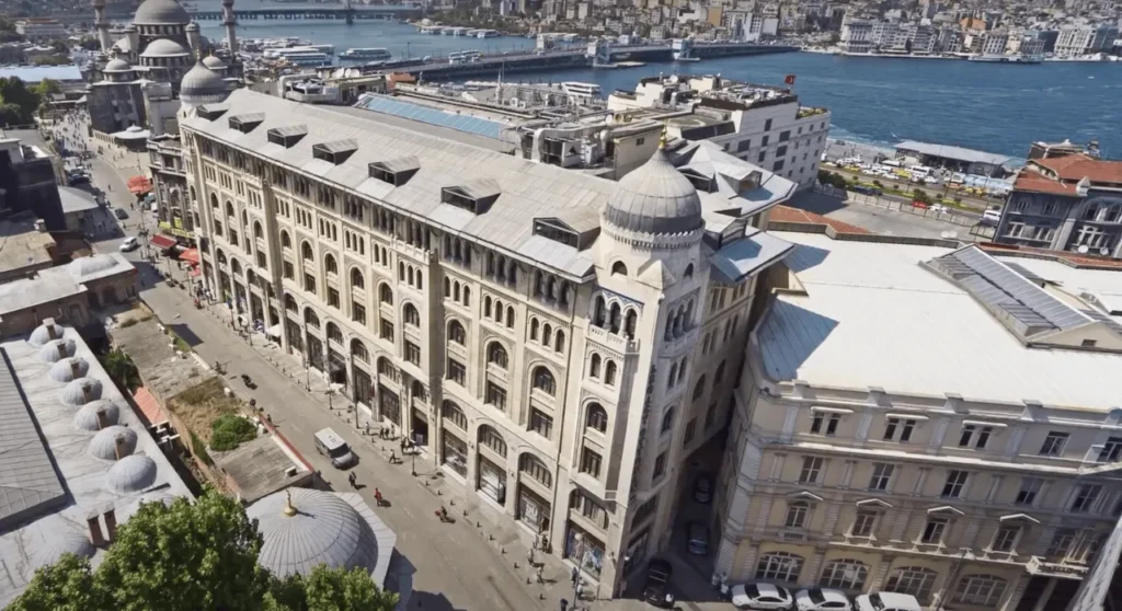 The aerial image captures a stunning view of the Legacy Ottoman Hotel in Istanbul, showcasing its grand architecture from above.