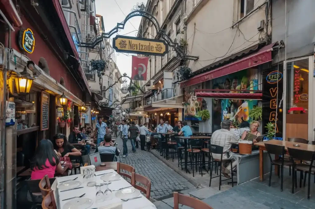 Nevizade Street near Istiklal Avenue, featuring a vibrant and bustling urban scene.