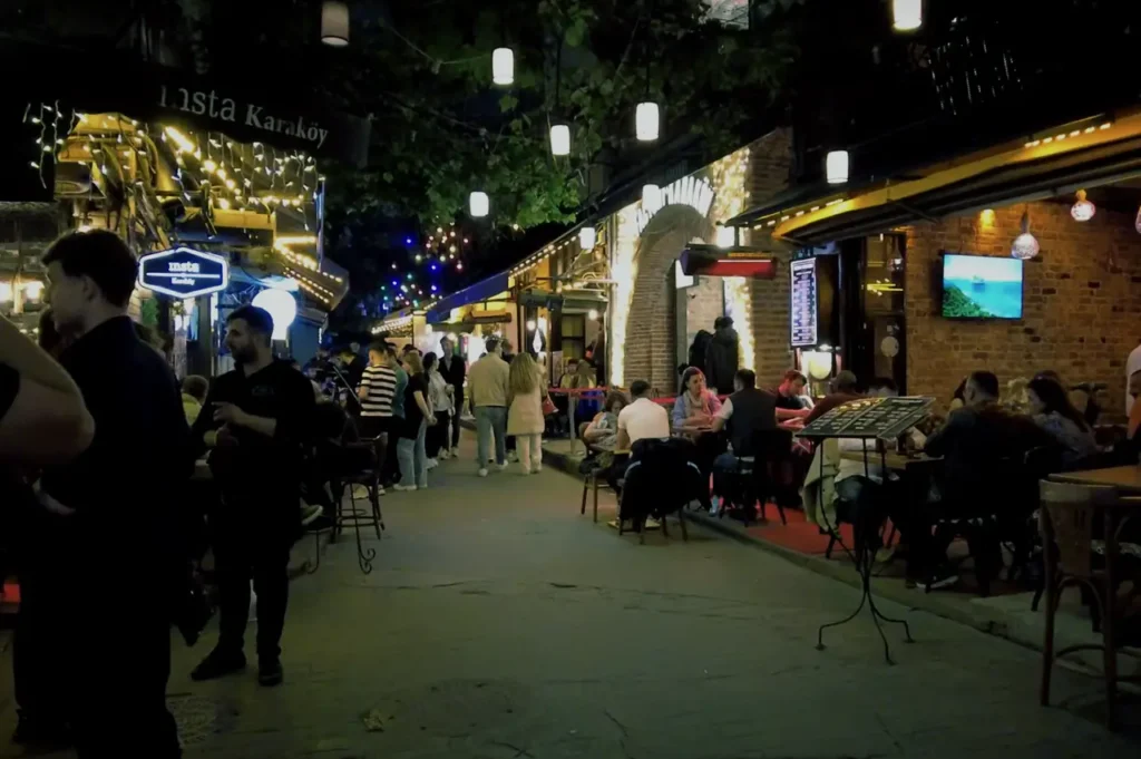 Crowded bars in Karaköy, with people enjoying drinks and socializing late into the night.