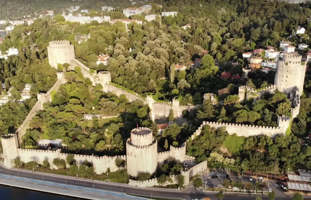 A drone view of Rumeli Hisarı, showcasing its towers and position along the Bosphorus.