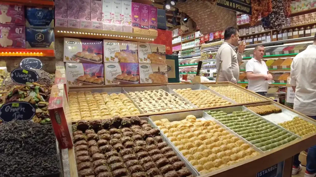 Baklava on display at the Spice Bazaar, with golden pastry layers and pistachio filling.