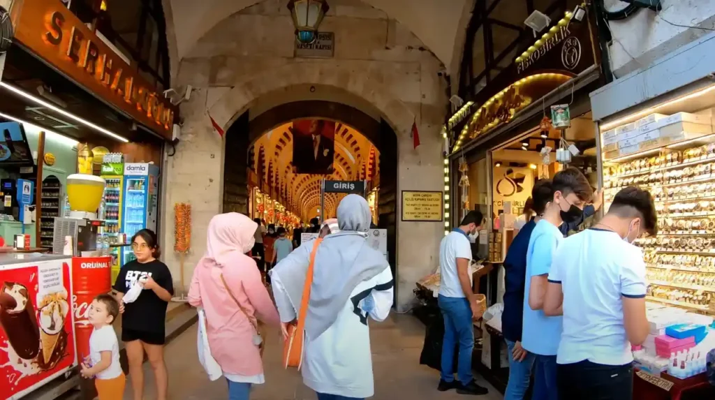 Entrance to the Spice Bazaar in Istanbul with a grand arched entryway and bustling crowds.
