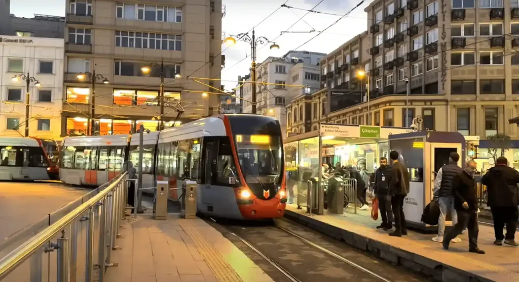 Tram T1 in the Old City of Istanbul in the evening, with street lights illuminating the historic streets.