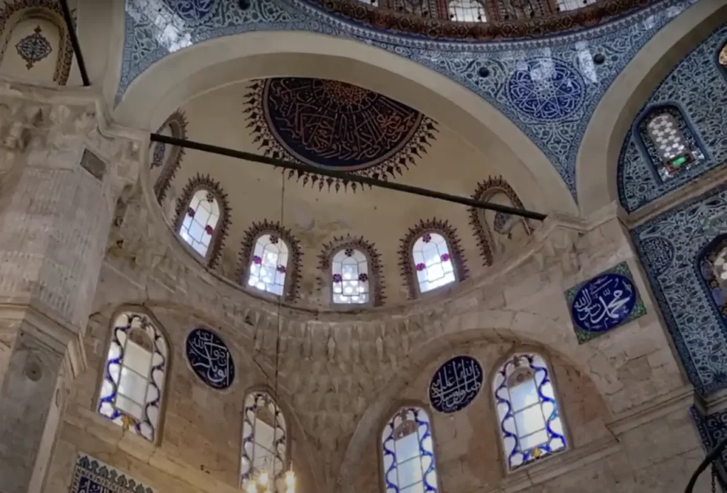 The intricate interior of Sokollu Mehmet Pasha Mosque in Istanbul, showcasing its detailed Islamic art and design.