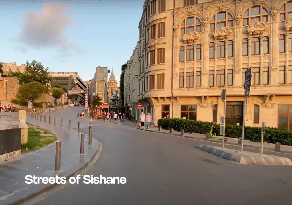A street view in Şişhane, Istanbul, with traditional buildings and modern touches.