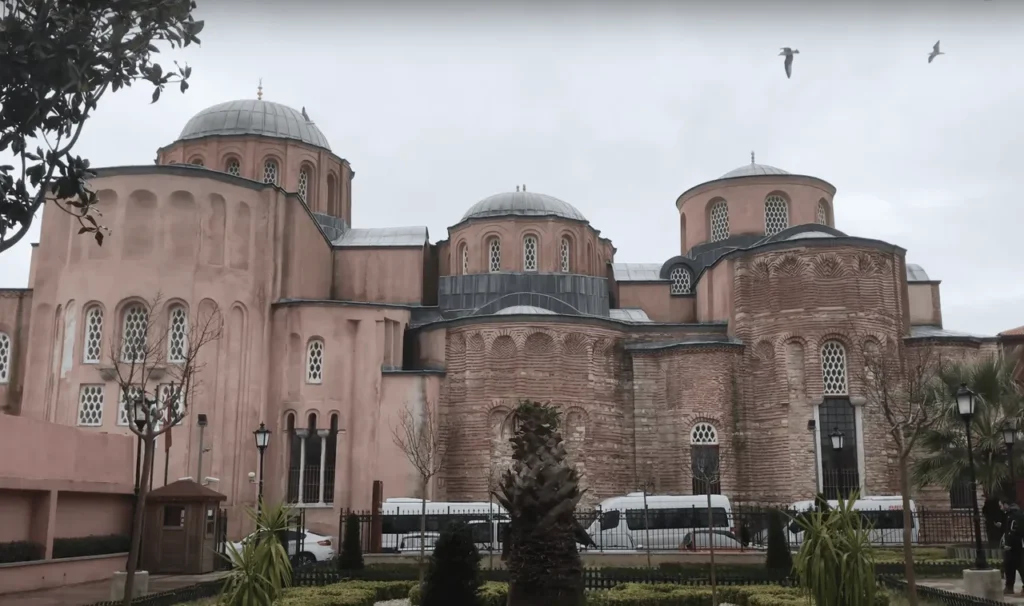 View of the Zeyrek Mosque Complex with red brick walls and domes.