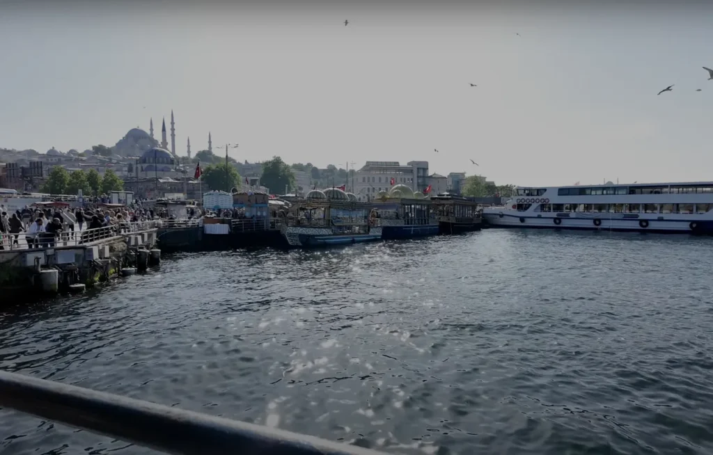 View of Eminönü Pier from Galata Bridge, with ferries and the waterfront.