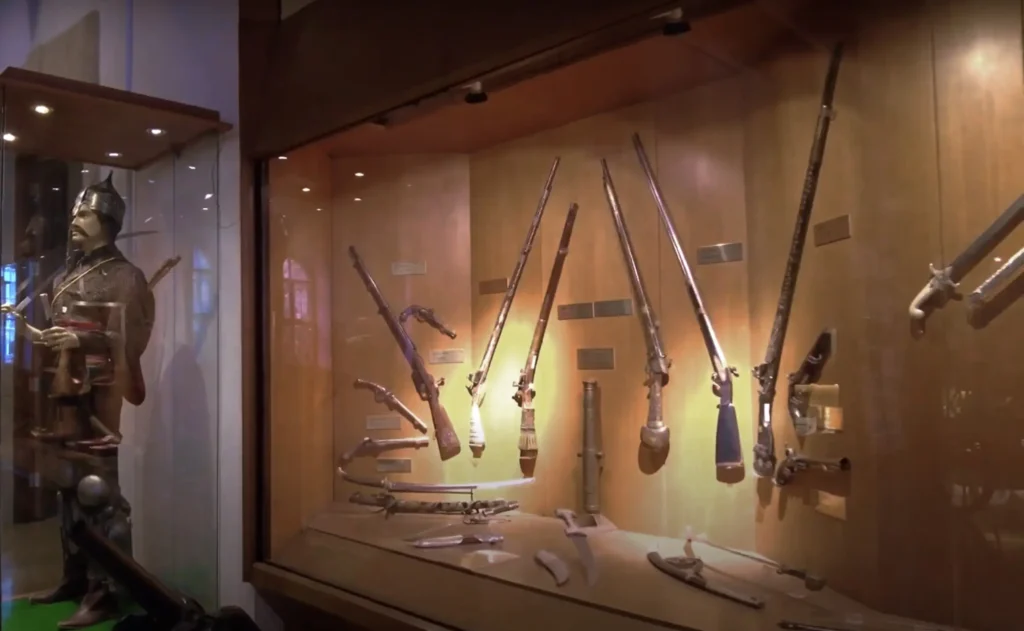 Historical weapons on display at the Istanbul Military Museum, including swords and firearms.