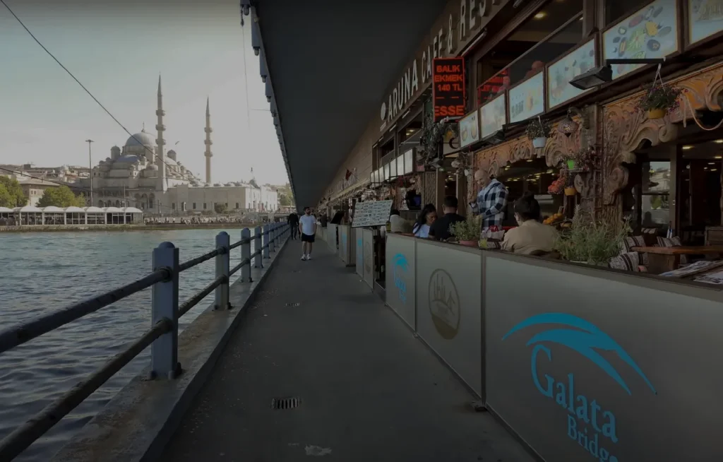 The lower floor of Galata Bridge with restaurants and shops along the waterfront.