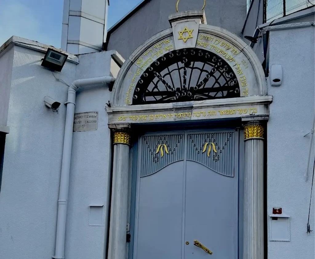Gates of ETZ Ahayim Synagogue in Istanbul, featuring ornate designs and historic architecture.
