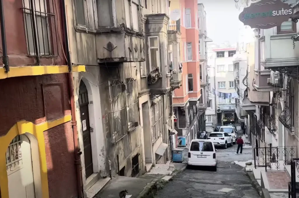 A view of the streets of Tarlabaşı, showing historic buildings and urban life in the neighborhood.