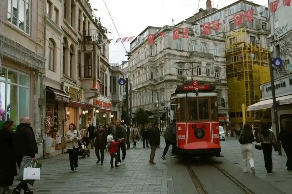 Tram on Istiklal Street, Istanbul, highlighting the historic transportation and vibrant atmosphere of the city's popular shopping avenue.