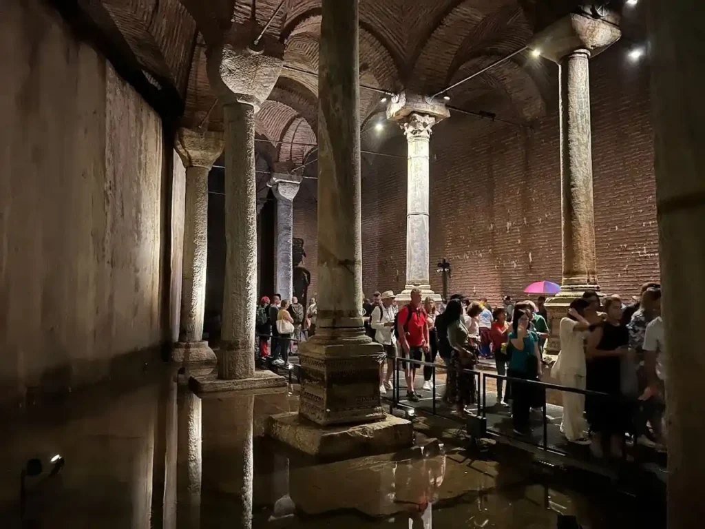 Columns in Theodosius Cistern with reflections in the water on the floor.
