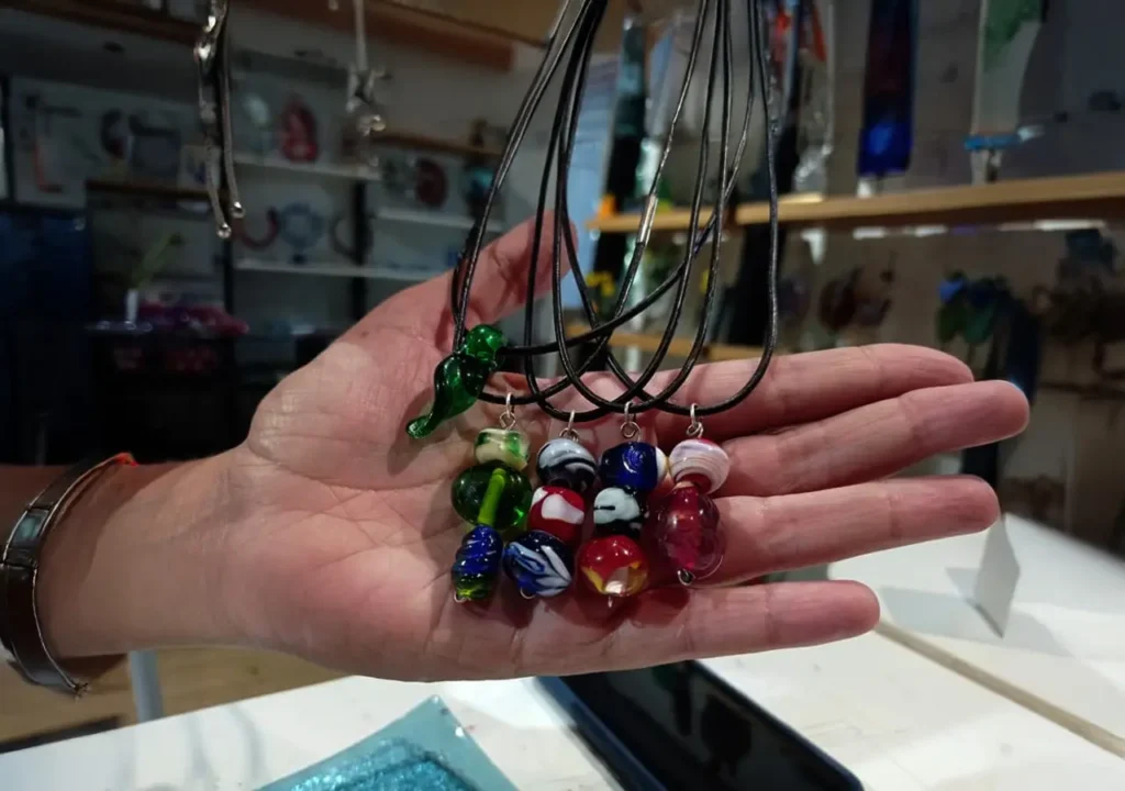 Glass pendants created at a flameworking workshop.