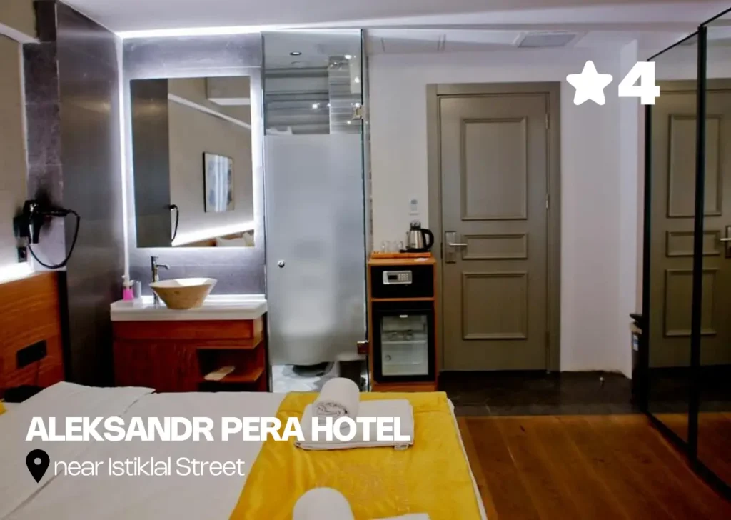Room at Aleksandr Pera Hotel with yellow accents and modern decor.