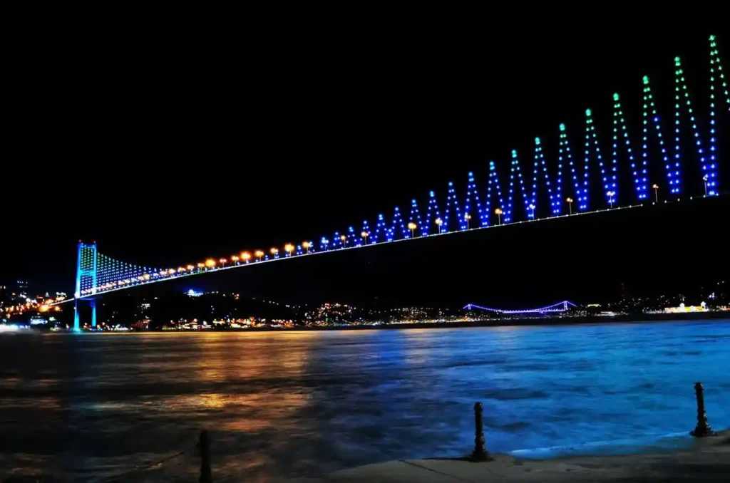 Bosphorus Bridge Illuminated at Night in Istanbul, Turkey.